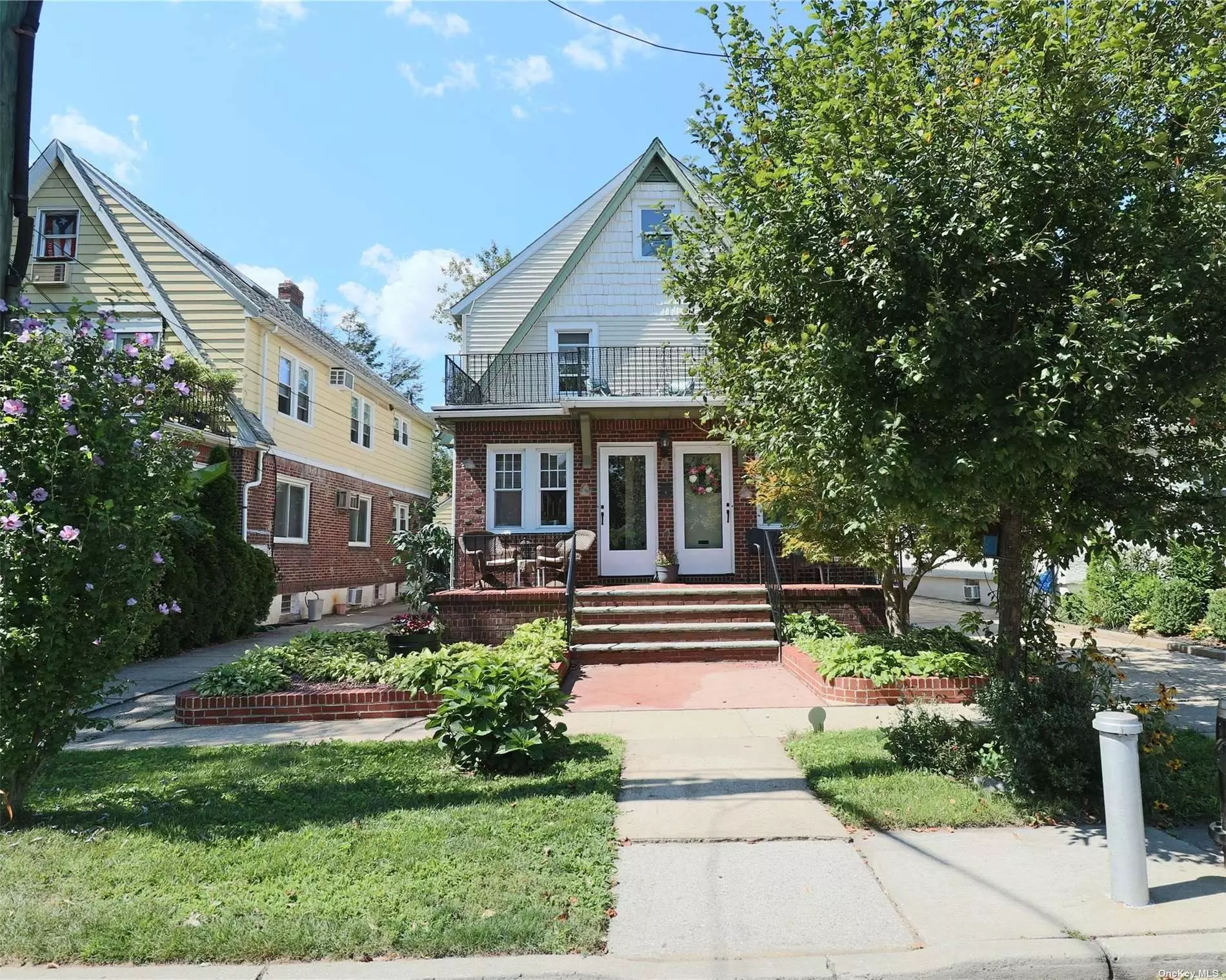 Two Family. Ready to Sell NOW... All Four levels have excellent features. On approach, there is a full-width front porch and a full-width terrace on the 2nd floor. The finished basement has an 8&rsquo; ceiling, and the two apartment ceilings are 9&rsquo;. The entire three-story back staircase to the Attic adds much potential use and value...When touring this property, focus on the architectural features, i.e., the abundance of closets, wood floors, original wood trim, and updated eat-in-size kitchens From the interior to the exterior. It is all pleasing to the eyes. L-O-N-G private driveway leading to a two-car garage and beautiful, private backyard, perfect for friends and family.