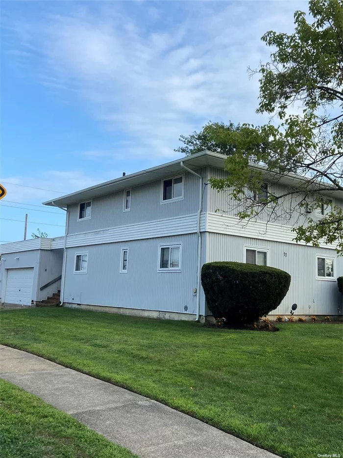 All new 2nd floor of dublex. New stainless steel appliances in large EIK. New bathroom with tub. New stackable W/D and new A/C. Lots of natural sunlight. Huge living room with 2 good size bedrooms and closets with storage. Use of left side of driveway and street parking near private entrance. Close to LIRR, Houses of Worship , Post Office and Village shops.