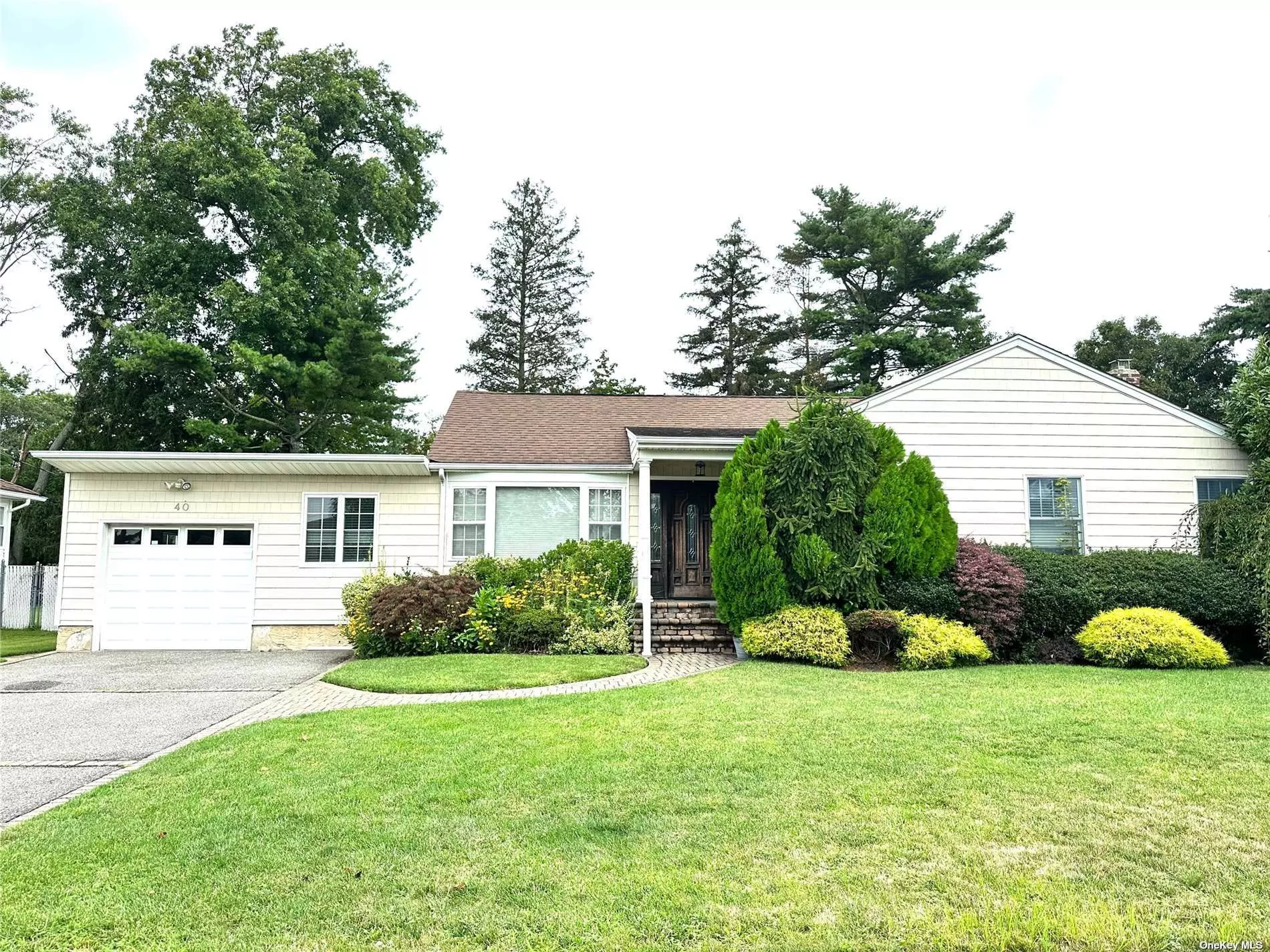 Welcome to this Beautiful Expanded Ranch House with 3 Bedrooms and 2.5 Bathrooms. This Lovely House Features a Living Room with Hardwood Floors. French Door to An Office Room Equipped with a Closet and Built-in Shelves for Documents and Storage. Perfect for Working at Home! A Formal Dining Room; Hallway Leads to the Master Bedroom with a Walk-in Closet, 2 Bedrooms & a Full Bathroom. A Large Eat-in Kitchen with Granite Counter Tops, Custom Made Cabinets and Heated Floors. Adjacent to it is a Dining Area with a Skylight and Many Windows that Flood in Lots of Natural Lighting. Sliding Doors to the Large Backyard. An Extended Family Room with High Ceiling and a Half Bathroom.  House has Built-in Surround Sound System including at the backyard. Central AC & Heat Controlled by Nest. Full Finished Basement with Open Space and a Full Bathroom, a Walk-in Storage Room and Utility Room with Laundry Area. Closet and One Extra Room can be Used as an Exercise Room. that is conveniently located in the Heart of Syosset! Close to All Major Highways, Shops, Restaurants, Malls, Supermarkets, and Schools, etc.