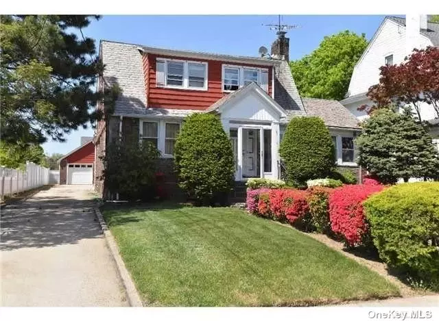 Move Right Into This Beautiful & Charming Cape Cod Style Located Mid-Block On A Very Quiet Street. It Features A Living Room With Fireplace, Formal Dining Room, Eat-In Kitchen. Gas Cooking, Heating System And Laundry, Room For Mom. Close To LIRR, Shopping, Bus And Major Highways.