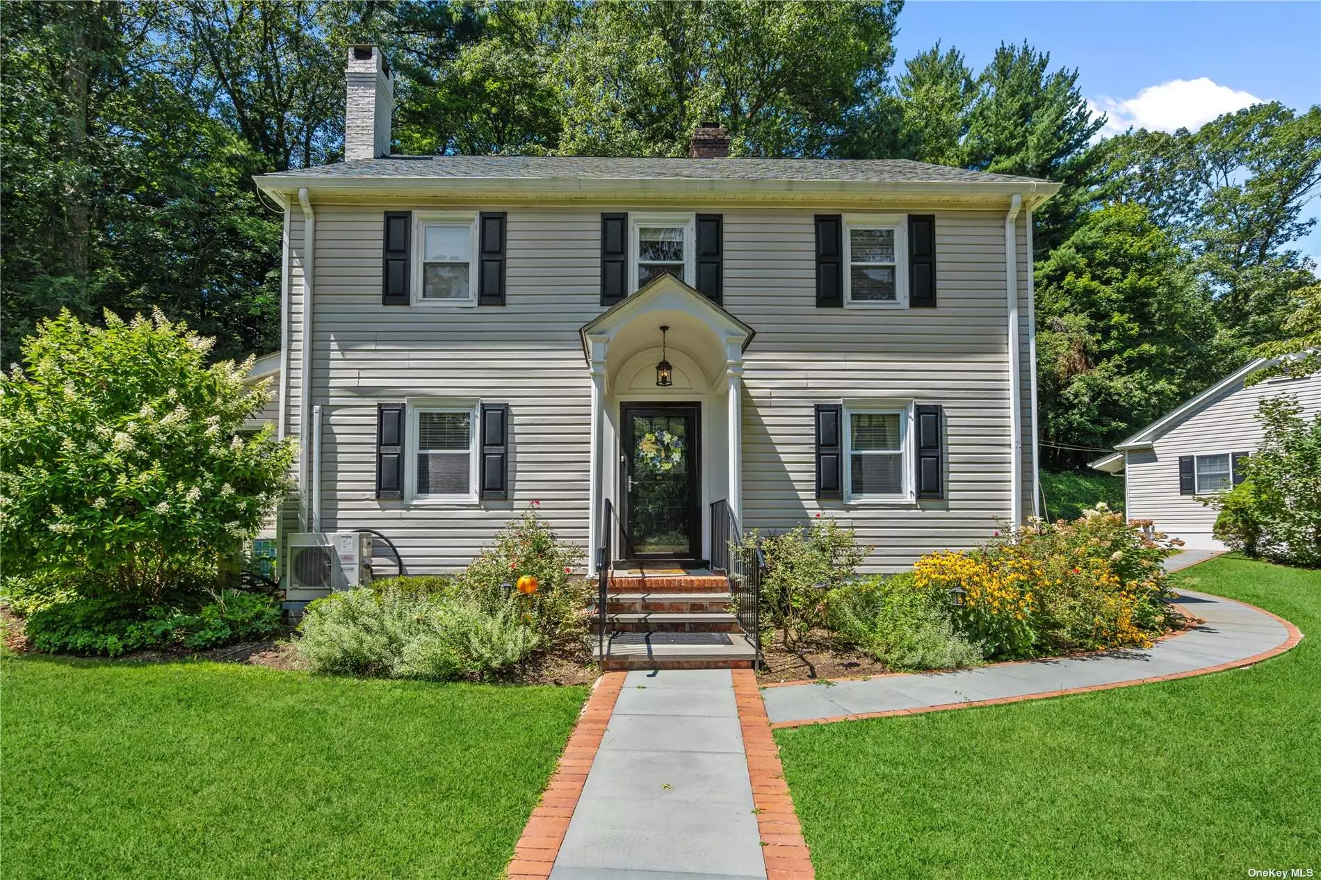 Welcome to 395 Mill River Road, Muttontown, NY. This home offers two homes for the price of one and is totally private on 2.44 acres. The main home offers 4 bedrooms. living room, dining room, den, eat in kitchen along with a finished attic. The cottage is a legal cottage that can be rented to family only. This cottage sits on top of your 4 car garage with a lift. The cottage has 2 large bedrooms, large living room and kitchen combo with full bath and attic.