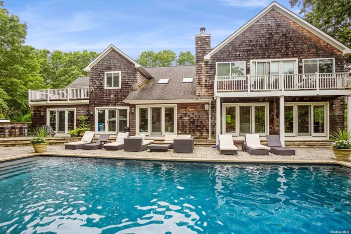 This luxurious resort-like oasis is nestled down a private road, set on two bucolic acres in Quogue adjoining a 6.5 acre reserve. The property offers something for everyone: a heated pool, spa, therapeutic ice bath, and outdoor shower; hat-tru tennis, pickleball, basketball, and beach volleyball courts; a large outdoor kitchen, barbeque, vegetable garden, and firepit; and a lushly landscaped backyard with extensive decks and seating areas. The spacious home includes six ensuite bedrooms, eight full bathrooms, a light-filled cathedral ceiling living room adjoining a kitchen, a formal dining room that accommodates sixteen, and a large family room with a piano and wet bar. The finished basement includes a ping pong table and a large gym decked out with a NordicTrack S22i cycle bike, rowing machine, elliptical, treadmill, and punching bag. Children can enjoy indoor and outdoor playsets, an activity center, a collection of games and books, and more. If you&rsquo;re able to tear yourself away from this private paradise, ride an electric bike (four come with the home) to the coveted Quogue Village Beach just minutes away, or visit the quaint Village of Quogue with a wonderful new market, local shops, and one of the best libraries in the country. Also nearby are Gabreski Airport, the Hampton Jitney, the Long Island Railroad, and the Village of Westhampton Beach with fabulous restaurants, shops, and a farmer&rsquo;s market. *NOTE: QUOGUE VILLAGE BEACH RIGHTS