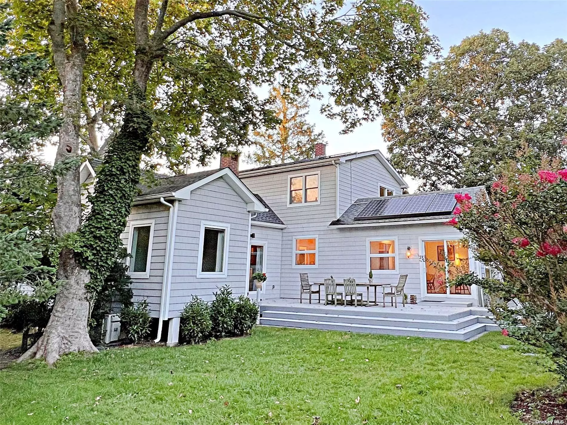 A sunny, flexible home on the rare triple lot in Greenport! This amazing house has a place for everyone to land, including a new and beautiful fully attached in-law apartment with huge windows, a wood-burning fireplace and a beautiful bath with a claw footed tub. The first floor also has a lovely sun porch in the front and large deck, perfect for entertaining. Upstairs is a primary suite with a Juliet balcony, a study, and a fourth bedroom. There is also a large finished basement suite with a private entrance. The backyard boasts a two-car garage that has a barn-like feel; perfect for an artists studio, two out buildings, and plenty of room for gardens and pool. Mature plantings give you privacy and tranquility - your own &rsquo;Secret Garden&rsquo;. This fully renovated beauty has all the amenities of modern life with the charm of the old world. Tucked away on a quiet block you are minutes from beaches, the Village, and the train to New York City. A unique home and rare opportunity!