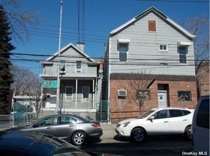 2-Buildings On 1-Lot. One Building Set Up Like Smaller 2.-Story detached 1-Dwelling house. The 2nd Much Larger Building 25X52 Is Used As Meeting Hall & 2nd Floor As Party/Dance Room. Approx. 1, 400 Sq. Ft. Per Floor, Large open space each floor with 9-Ft high Ceilings, and basement. 5-Car Garage Behind Building.