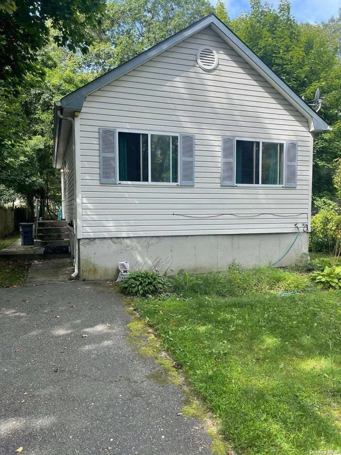 Move in Condition. Affordable 2 Bedroom Ranch featuring cathedral ceilings and skylights, Open floor plan, Sliding glass doors to a private deck. Full basement w/high ceilings and outside entrance. Why rent when you can own. Low taxes close to shopping