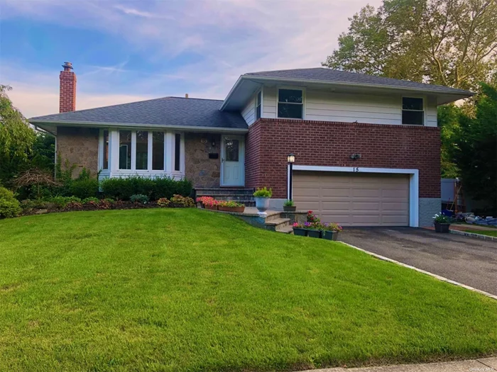 3 Bedroom 2.5 Bath Syosset Split, Mid Block Location. Nicely Renovated Kitchen and Bathroom. Open Concept Living Room/ Dining Combination, Large Kitchen, Family Room. Large Family Room w/ Outside Entrance. Private Driveway and Garage, Fenced Yard, Finished Basement.