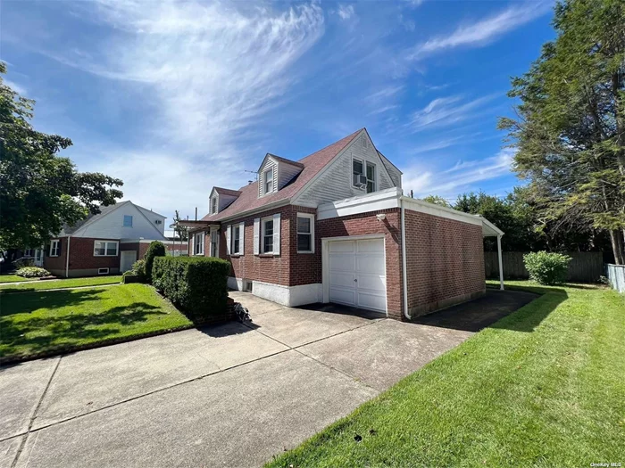 :A Must See - Located in the heart of New Hyde Park, this 4 Bedroom, 2 Full Bath Property. The Full Finished Basement, Features Family and Mechanical Rooms. 1st Floor features LR, DR, Kitchen, 2 beds 1 bath, 2nd Floor 2 beds 1 bath. Private Driveway, garage and a large backyard, Close to Michael J Tully Park, Schools, LIRR, buses and Jericho turnpike Shopping centers. Low Taxes!