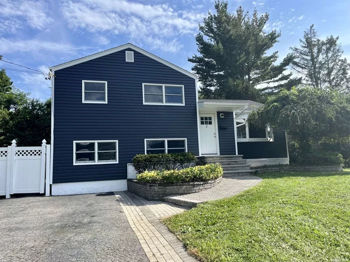 INCREDIBLE OPPORTUNITY TO PURCHASE A HOME WITH BUILT IN EQUITY (comparable properties are valued at $750, 000). Welcome to this beautifully renovated corner lot split-level property in the heart of West Islip. This home has been meticulously updated from top to bottom, boasting brand new wood floors that add warmth and sophistication to every room. The kitchen gleams with modernity, featuring new appliances that are ready to inspire your culinary adventures. With a new roof and vinyl siding, this residence not only shines aesthetically but offers peace of mind. Stay cozy year-round with efficient gas heating, and enjoy the spacious backyard, perfect for gatherings and relaxation. Inside, discover a den and family room adorned with plush new carpeting, providing comfort and versatility. The substantial crawl space and ample-sized attic offer convenient storage solutions. This is an opportunity to move into a truly turnkey home, where modern living meets classic charm in the desirable community of West Islip.