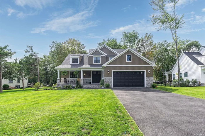 Welcome to 465 Mailer Court, a beautiful craftsman-style house, centrally located in the sought-after Founders Landing Park district of Southold. Newly constructed and completed in 2022, this 4 bedroom home with vertical siding and stone exterior introduces a spacious open floor plan with first floor primary bedroom suite. Features such as an 11&rsquo; ceiling height through the main living areas, a 7&rsquo; island with seating at the kitchen, large sliding glass doors in the dining area to a covered rear porch and a great room with gas fireplace and rear yard view combine to create a beautiful, spacious home for family living and holiday gatherings. Entry from the garage through a mud room/family foyer offers a great drop zone for beachwear, mail and shoes; while the laundry room is conveniently located near the garage, primary bedroom and stairs to the second floor bedrooms. The primary bedroom suite offers 9&rsquo; ceilings and a private bathroom that features a double vanity, large shower enclosure and walk-in closet. A full unfinished basement with high ceilings offers space for a future rec room, additional living space and/or storage as needed. Smart home technology throughout provides seamless wifi controls for light switches, climate control, entertainment and more! The backyard offers plenty of room for a pool and the home is centrally located Southold&rsquo;s best bay beaches! This fully upgraded newly constructed home will not last!