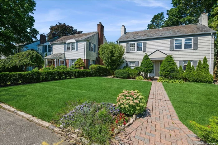 Situated closely to the LIRR, shops on Plandome Road, and Manhasset schools, this move-in-ready brick townhouse sits perfectly on quiet, tree-lined, Travers St. On the first floor, the living room is fit with a custom built-in bookcase and wood burning fireplace. The kitchen is outfitted with stainless steel appliances, and there is a beautiful full bathroom just off the kitchen. The second floor is two bedrooms and another full bathroom. The townhouse has a fully finished basement. The entire house has central air conditioning, and a brand new septic system was installed in 2022. Outside,  you can enjoy the private yard, as well as the patio in the nice weather.