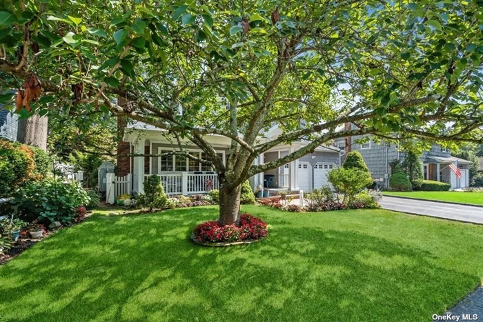 The welcoming bluestone front porch sets this stunning 4-bedroom colonial apart from any other home in charming North Syosset. You are steps away from warmth, comfort, style and open floor plan living spaces. Rich hardwood floors are mainly throughout the first and second floors. A large, sunlit living room has a woodburning fireplace with custom surround and mantle. The banquet sized dining room, with built-in cabinetry and serving bar, flows easily from the living room and has sliding doors to rear porch and patio. Adjoining the formal dining room is an expanded chef&rsquo;s kitchen with stainless steel appliances, tray ceiling and oversized picture windows. If you love entertaining guests or enjoy quiet time, the den is going to be a favorite spot. Four large picture windows and a full glass door provide seasonal vistas. The second floor has a large primary suite with 2 walk-in closets, primary ensuite bath and gleaming hardwood floors. There are 3 additional bedrooms, which are oversized, all with ample closet space and a hallway full bath. The lower level was completely renovated with a state-of-the-art Owens Corning basement system. Perfect as a rec room, den or workspace. This charming colonial is completed with outdoor space, a lush lawn, perennial plantings, specimen trees, landscape lighting on timers, brick patio, bluestone porch and a white PVC picket fence. Additional features include a 2-car garage, underground sprinklers, 4-car driveway, 3 zone heat, 2 zone central air, alarm and Andersen windows. Clearly a North Syosset gem!