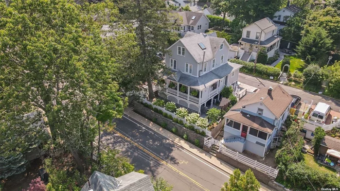 Nestled within the charming Victorian Village of Sea Cliff, 347 Glen Avenue stands as a stunning testament to the timeless elegance of a bygone era. This fully renovated 3-bedroom Colonial, originally built in 1929, has been meticulously updated to seamlessly blend its historic character with modern luxury. Features an Azek wraparound porch, beautiful hardwood floors, living room with oversized windows for loads of sunlight, dining room with sliders to side porch and patio, eat-in kitchen with vaulted ceilings, quartz countertops and high-end GE appliances. Second floor continues with three bedrooms, a full bath with stall shower and soaking tub and separate laundry room. A fully finished and legal walk-up third story bonus room with skylights. Full expanded basement with poured concrete walls and 8&rsquo; ceilings with walkout to front yard. Lots of outdoor entertaining spaces and minimal landscaping upkeep.