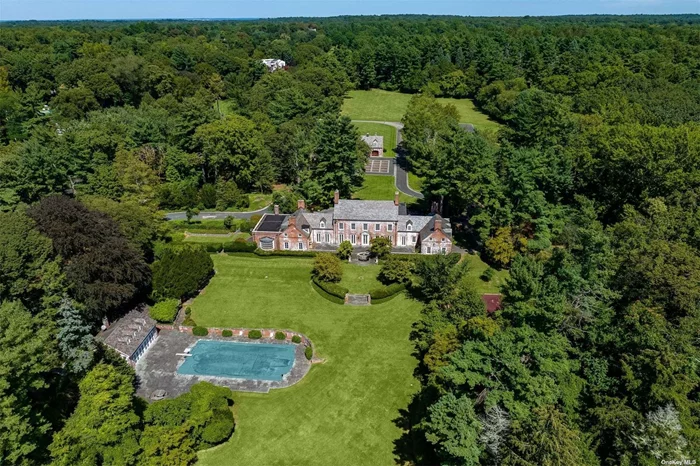 Sunninghill Estate -This iconic property, built in 1928, exudes the classic charm of a Brick Georgian Manor while offering an expansive canvas for modernization. Situated on over 27 sprawling acres of prime real estate, it presents a unique opportunity to own a piece of Long Island&rsquo;s prestigious architectural history. Just under 10, 000 square feet of living space, this magnificent residence boasts six generously sized bedrooms, 8 bathrooms and 6 inviting fireplaces,  The estate also features an 8-car garage with spacious living quarters above, and with some updates it will make a perfect place for guests. A charming guest cottage provides additional accommodation options. Sunninghill Estate offers a plethora of recreational amenities including 1/4 mile trail, pool, pool house and tennis court. The main house of Sunninghill Estate exhibits excellent structural integrity w/recent upgrades, such as all new custom Marvin windows, a new slate roof with copper leaders and gutters, updated AC and boilers. The interior is bathed in natural light thanks to floor-to-ceiling windows and doors, highlighting the intricate wood and marble inlay floors as well as the ornate wood moldings that adorn the living spaces. The home also offers a first-floor master suite. 25 miles to NYC, world-class shopping, fine dining and renowned schools, this estate combines timeless allure with the potential for modern luxury living. Possible subdivision, 3 acre zoning