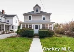 Vintage 3 Br colonial on 50x124 in Great Neck North. Screened-in front porch, LR has gas fireplace, large FDR, eat-in-kitchen.
