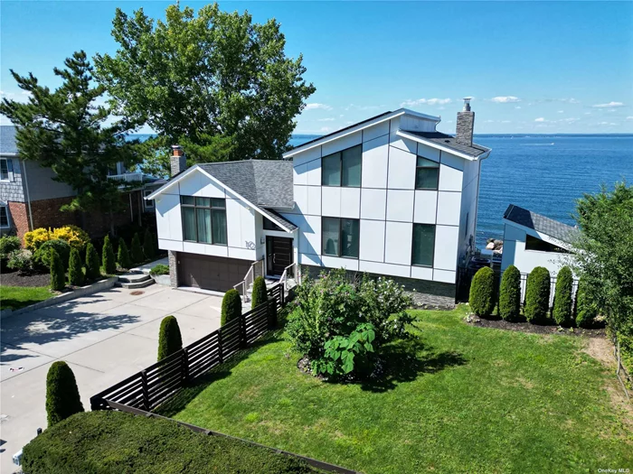 Welcome to your waterfront paradise! This modern renovated residence offers stunning 180-degree vistas of Long Island Sound, complete with breathtaking sunsets, multiple balconies, and an expansive patio that leads to a heated in-ground saltwater pool, all just steps away from your own private beach (this home is NOT in a flood zone, no flood insurance required!). With a striking open floor plan featuring vaulted ceilings, a gourmet kitchen outfitted with top-of-the-line German appliances, a dining area equipped with a hidden bar, four bedrooms, four baths, two cozy fireplaces, central air, central vacuum, a backup generator, and a huge (150 sq ft!) detached shed, this home truly has it all. The layout is perfect for accommodating both family and guests, spanning three floors of luxurious living and boasting outdoor kitchen on one level, and grill on another, making it the ultimate setting for extraordinary entertaining. Boasting a prime location just beyond Lattingtown, at the beginning of Bayville heading east, this property is conveniently situated only 45 minutes from NYC and 90 minutes from the Hamptons, easy access to local stores, supermarkets, a playground, and an adventure park. Plus, it&rsquo;s been featured on Hulu! Current taxes less than $17, 000! (4-zone gas heat, 3-zone CAC, Solar Panels, New roof, Pella windows, and more).