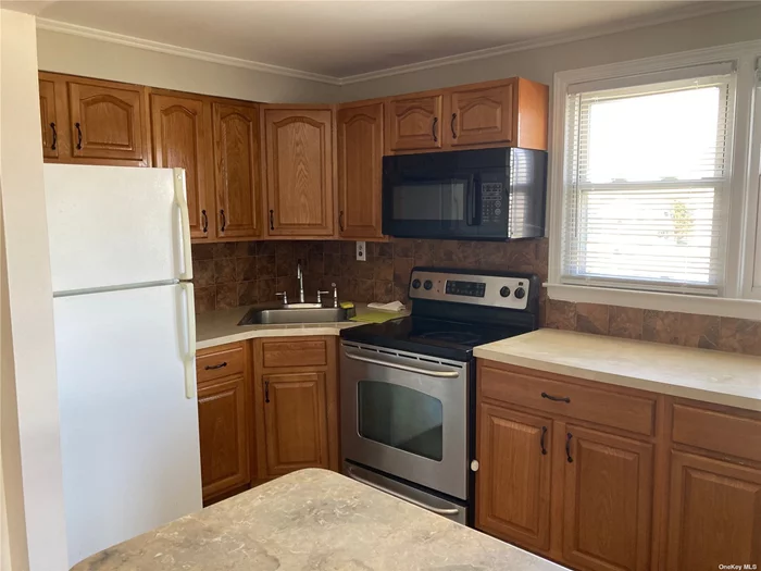 Beautiful sunny 1 bedroom upper floor apartment with EIK and newly updated bathroom. Tenant is allowed to park 1 car in driveway. 1 small pet allowed. All applications through NTN.
