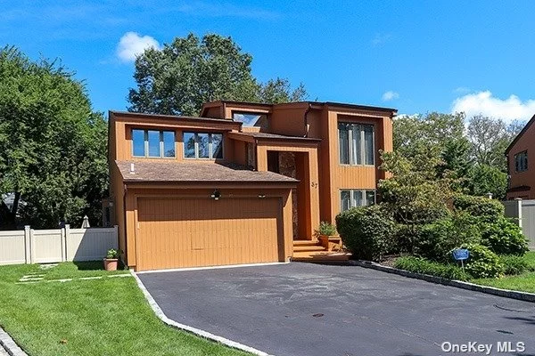 As you approach this stunning home, you&rsquo;ll be captivated by its striking curb appeal. The contemporary design is characterized by clean lines, large windows, and a harmonious mix of natural and man-made materials. The exterior is adorned with cedar,  and sleek architectural details, creating a captivating visual aesthetic. Upon entering, you&rsquo;re greeted by an open and inviting floor plan that seamlessly integrates the living spaces. The main level features a spacious living room bathed in natural light from expansive windows that frame the lush outdoor landscape. The neutral color palette enhance the sense of warmth and sophistication throughout the home.The gourmet kitchen is a chef&rsquo;s dream, equipped with top-of-the-line stainless steel appliances, stone countertops, and custom cabinetry, oversized counter space provides both a functional workspace and a casual dining area, making it the heart of the home. This contemporary gem boasts four generously sized bedrooms, each with its own unique character and ample closet space. The master suite is a true retreat, featuring a spa-like ensuite bathroom and a walk-in closet. Large windows in every bedroom allow for plenty of natural light and offer beautiful views of the surrounding greenery. In addition to the master ensuite, there are two and a half bathrooms in this home. They are all elegantly designed with modern fixtures and tasteful finishes. The half bath on the main level is perfect for guests, while the additional bathrooms are well-appointed for family members or overnight visitors. The outdoor living space is a serene oasis, offering a perfect balance of privacy and natural beauty. A spacious deck provides an ideal spot for outdoor dining and entertaining, while the landscaped backyard offers room for gardening and recreation. The cul-de-sac location ensures a peaceful and secure environment. Nestled in the sought-after community of Greenvale in the Roslyn School District, this home offers the best of both worlds - a tranquil suburban setting with easy access to all the amenities and conveniences of nearby towns. Greenvale is known for its top-rated schools, parks, and proximity to shopping, dining, and transportation.This 4-bedroom, 3.5-bath contemporary home in Greenvale, New York, embodies the essence of modern living while providing a warm and welcoming atmosphere. It&rsquo;s a place where sophistication and comfort coexist, offering the perfect canvas for creating lasting memories in a beautiful suburban enclave.