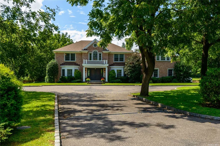 This impressive and young custom brick classic center hall colonial set on 2.12 flat acres on a cul-de-sac street offers a very special opportunity in Old Westbury. This distinctive home features a marble 20+ ft high entry foyer, sweeping staircase, coffered ceilings, wainscot raised paneling, detailed moldings, inlay wood floors and 10 ft ceilings. Beautiful property, towering trees and manicured lawns frame this bright and airy like new 5200 sq ft home in Jericho school district. Enhanced by an exceptional blend of casual living and elegant entertaining.