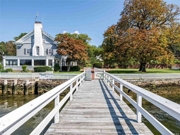 Prestigious waterfront estate and cottage in the sought-after historic whaling village of Cold Spring Harbor. Enjoy your very own private dock, equipped with an 8&rsquo; draw at low tide and located just outside your back door. Enjoy western sunsets and the ever changing landscape of the protected harbor. This 4, 500-square-foot home is steeped in history, has seven bedrooms and 4.5 baths all with timeless charm and character. High ceilings, classic architecture, four fireplaces, expansive rooms, and a sunroom, along with the warmth of hardwood floors, create a sense of grandeur and heritage. Situated on a shy flat acre, the property offers a sprawling canvas of greenery and serene blue waters. A six foot stately brick wall and wrought iron gate provide the ultmate in privacy at this estate. The covered porch entry welcomes you with an inviting embrace, setting the tone for the space and serenity that awaits inside. The spacious rooms provide a sense of freedom and flexibility, allowing you to personalize each space with no need for expansion. The CSH community boasts charming shops, restaurants, parks, trails, Eagle Dock Beach( fee), and museums.  Convenient commute to NYC via nearby train or parkways.