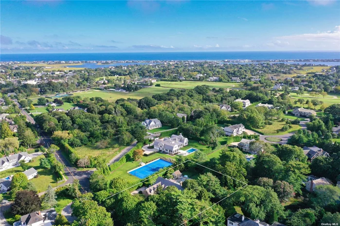 In the vibrant heart of Westhampton Beach Village, find a residence where post-modern design dances harmoniously with luxurious refinement. Resting on a generous .92-acre expanse, this home stretches across an impressive 5, 400 square feet, enveloped in superior finishes and vast living spaces and is just 1.5 mile from Dune Road. Every step within reveals open spaces and privacy alike. The sun-drenched living room with expansive ceilings feels bright and grand, courtesy of its prime south-facing alignment. The radiance emanating throughout accentuates the inherent charm and sophistication of the space. Six spacious bedrooms serve as personal retreats, each offering the flexibility to cater to every familial need. A modern yet classic eat-in kitchen beckons culinary adventures, seamlessly blending functionality with style including Wolf and Sub-Zero appliances. Adjacently, the all-weather room stands as a beacon for relaxation, ensuring enjoyment across seasons. Journey to the 1, 400 square foot lower level not included in the home square footage, to unveil a finished basement, with a cozy and well-equipped media room with theater style seating and a Pool Table. This sanctuary promises countless hours of entertainment, bringing cinematic experiences right to your doorstep. The house boasts four lavishly detailed full bathrooms alongside two gracefully appointed half baths, with each space echoing traditional elegance. Central to the home, a fireplace bestows a touch of warmth, setting the stage for intimate gatherings and quiet reflection. Beyond the interiors, the outdoors entices with a heated salt water gunite pool, a beckoning oasis for summer splashes and wintery dips alike. A stylish pool house with half bath and outdoor shower sits ready, ensuring every event becomes a cherished memory. While ensconced in the buzz of Westhampton Beach Village, with its chic boutiques, delectable dining, and lively events, this home offers an enclave of serene privacy and luxury. Step into a world where style, comfort, and grandeur converge. Your refined Hamptons sanctuary awaits. Close to places of worship.