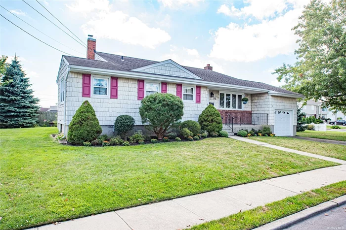 Spacious front-to-back split with expanded kitchen/dining area. Updated gas boiler, electric service, .5 bath, etc. Cathedral ceilings in the living room and dining room. Hardwood floors and LOTS more . . .