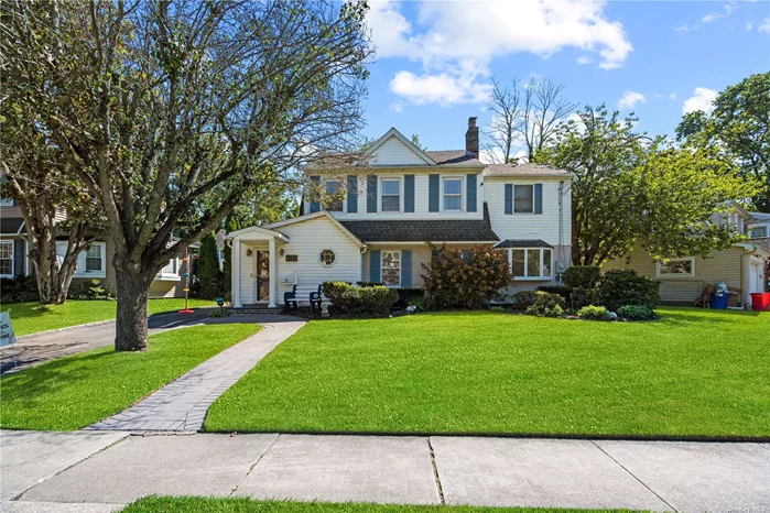 Incredibly charming colonial located just blocks from town center, LIRR and playground! COMPLETELY renovated home and lovingly maintained with cac, hardwood floors, full attic and full basement. French doors lead from home onto the patio and fenced yard providing privacy and beautifully landscaped grounds. Interior of home has a double sided fireplace, large dining room, open concept renovated kitchen with an island, abundant natural light, storage and workspace. Primary suite has a fully renovated bath, walk in closet. There is a full walk up attic and a two car garage. New furnace, water heater, and cac system. A rare opportunity with low taxes and great midblock location, the perfect house to call your home.