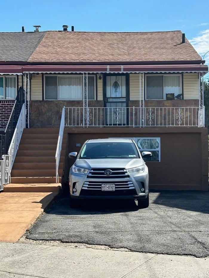 One block from the beach! 2 family mother/daughter home. Top-level 3 bedrooms, 1 bath, living room, kitchen and dining, step down to lower level with family room, and laundry room. Side door entrance to 1 bedroom apartment.