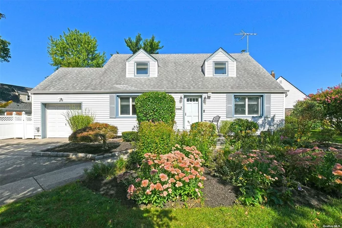 This perfectly situated beautiful and serene, dormered cape cod stye home features 4 large bedrooms and 3 full bathrooms. This home also boasts central air conditioning, gas heat, gas cooking, gas fireplace and a full house generator! Brand new top-of-the-line appliances, Anderson windows. The peaceful yard highlights custom landscaping and specimen plantings; is fully fenced and has plenty of room to play and entertain. This home checks all of the boxes. Overall pride of ownership in this well maintained and spacious home. Plenty of room to live, work and play from home and conveniently located near shopping, schools, transportation and more!