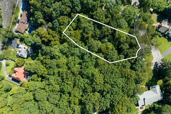 Rare opportunity to purchase scenic, vacant land at the end of a cul-de-sac on quiet and quaint street located only half-a-mile from downtown Greenlawn. Great for an end-user or developer/investor to build a dream home surrounded by a beautiful wooded setting.