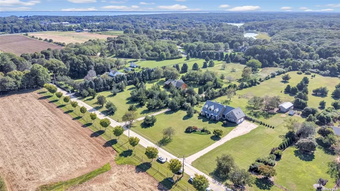 Builder&rsquo;s Custom Own, Rare 5 Acre Equestrian Estate, surrounded by preserved County Land in the rear and Farmland with Development Rights Sold across the street! This fabulous home was built with an abundance of love, quality and pride, and it shows! The home features a Foyer and Living Room with soaring 20 foot ceilings, white oak floors, a highly-desired First Floor Primary Ensuite with pasture views, a Home Office/Bonus Room and a Living Room with a warm and enchanting wood-burning fireplace, to add ambiance and cheer to those colder winter evenings! The upstairs features two additional, Generously-sized Bedrooms, as well as a Legal Accessory Apartment, with a separate entrance, perfect for a Family member or other tenant. The Property boasts a Barn and Paddock, ideal to exercise and ride your horses in the beautiful North Fork countryside! The huge, unfinished Basement with 9 foot ceilings offers many opportunities to finish and add additional living/recreational space for friends and family alike! The home also features a complete water-filtration system as well as a gas conversion available from the street. The property is surrounded by North Fork majestic farmlands, vineyards and countryside, yet is within close proximity to beaches, restaurants, shops, farmstands and the award-winning vineyards of the North Fork!! Truly, a one-of-a-kind property, which will take your breath away!!