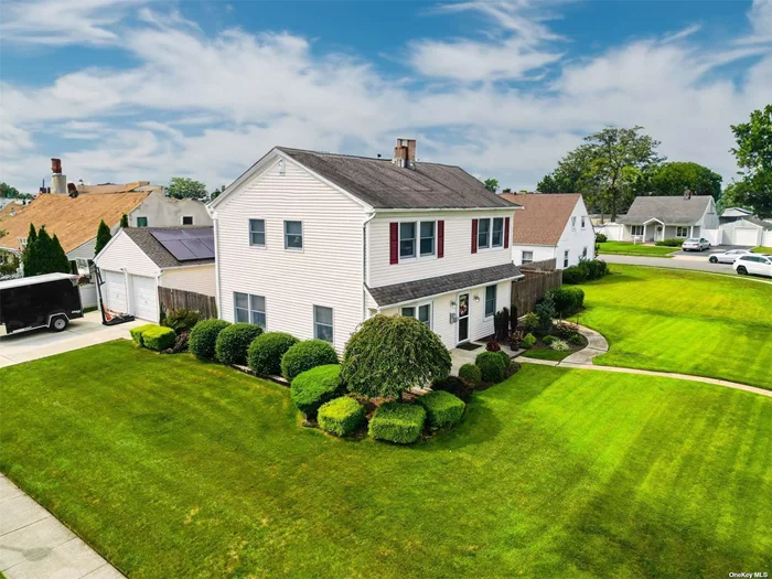 Welcome home to this exceptionally well maintained/centrally and conveniently located Levittown Colonial! Upon arriving to this stunning corner lot home, its pristine curb appeal will draw you to its meticulously kept grounds, new 2023 walkways, 2 car private driveway, 2 car HEATED detached garage, fully fenced backyard with 2 gates and you have not been inside yet! Once inside you will continue to be captivated by the open concept dining room/living room, breakfast bar center island, updated kitchen with beautiful white quartz countertops, undercabinet kitchen lighting, 1st floor full bathroom, luxurious Wi-Fi enabled Samsung refrigerator, farm style sink and stunning floors! Owners pride exudes throughout the entire home! Upstairs you will rejoice in finding 4 bedrooms, a large primary bedroom with ample storage, a full bathroom with amazing Bluetooth enabled/music playing exhaust fan so you can enjoy your long hot shower/bath since the home has an less than 1 year old instant hot tankless coil water heater. Enjoy this beautiful 4 bedroom 2 bathroom Colonial and all its glory. Move right in and start living!