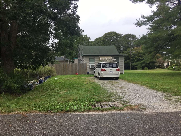 Calling All Investors/Handymen 2 Bedroom 1 Bathroom Cape on Large Corner Lot.This property has so much potential, just under a 1/2 acre with room for a pool. Home is being sold AS IS. LOW TAXES - 2023 Taxes are Just $4, 154.72 AFTER Basic STAR Rebate.Price is negligible, owner wants to hear all offers!!!