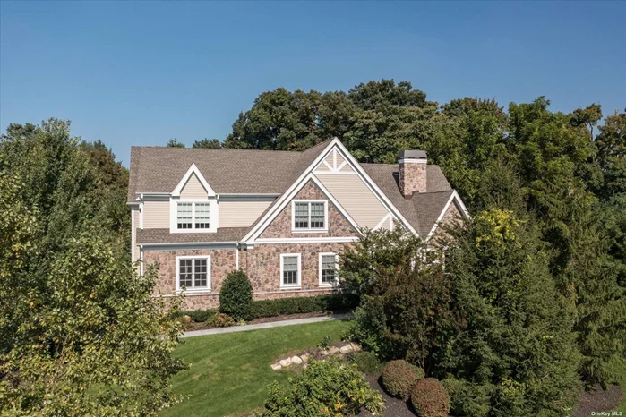 Welcome to this Beautiful Colonial in Stonehill at Muttontown. Situated on a private cul-de-sac, this stunning 5 bedroom, 4.5 bathroom home was built in 2017 and is set on .8 acres. With 3 sun-filled and spacious living areas featuring high ceilings and impeccable millwork. The open floor plan allows for a seamless flow between the Eat-in Kitchen, Living Room/Dining Room, Great Room and Den. The first floor also features a home office, mudroom entrance from the 3-car garage, and a powder room for guests. The second floor boasts a primary suite with a sitting room and expansive bathroom, 3 additional en-suite bedrooms, and laundry. Hardwood floors add warmth and charm to the interior, while three fireplaces create a cozy ambiance. Outside, the newly landscaped and fenced yard is perfect for outdoor activities and gatherings. The gated community offers a range of amenities, including a indoor pool, tennis courts, and gym. Conveniently located to shopping and transportation. Syosset Schools.