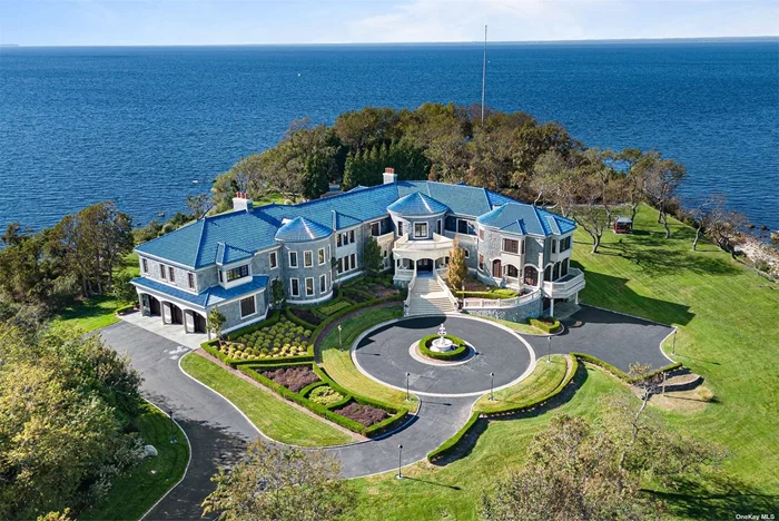 A gorgeous waterfront estate on Crane Neck Point, this home is one of a kind. Architecturally designed to take advantage of an extraordinary 10+/- acre lot with 300 degree views of the Long Island Sound, the home is perfectly built on a curve. There is also access to half a mile of private beach and a grandfathered cabana. Located at the very end of Crane Neck Road in the village of Old Field, this unique offering is unlike any other on the North Shore given how rare it is to find an entire peninsula as one lot. This home is completely custom built with approximately 20, 000 livable square feet. The welcoming, grand entry foyer features a double staircase. There are 6 bedrooms, four of which are private suites with a sitting room, walk-in closets, and en suite baths, plus 7 full bathrooms and 1 powder rooms. The beautifully appointed living spaces include a library, solarium, formal dining and living rooms, a massive kitchen that opens to a double-height great room, an apartment with separate entrance, a gym, wine cellar, oversized basement with 10&rsquo; ceilings, and a five-car garage with custom cabinetry. There are granite floors in the kitchen, marble in the hallways and bathrooms, and gorgeous hardwood floors throughout the rest of the home. Additionally, this home boasts exceptional mill work, mahogany windows, and wrought-iron staircases. The outdoor entertainment space is complete with a 46&rsquo; gunite pool, pergola with full wet bar, bocce court, a pond, and of course 2, 500&rsquo; of private beach. The exterior of the house with its 100 year guaranteed Ludowici glazed tile roof, Connecticut river granite exterior facade, marble dust composite columns and blue stone porcelain tiles perfectly complements the natural surroundings. The elevated bluff lends to the coastal Italian vibes.