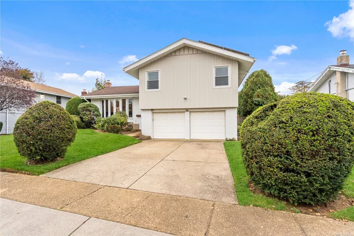 Jericho - East Birchwood. Split Level on a quiet tree lined street. 4 Bedroom, 2.5 Bathrooms, Open floor plan, Hardwood floors. New roof, siding, solar panels and windows. Large lush green private flat backyard. Close to LIRR, schools, shopping and highways. Syosset Schools. Being sold as is.