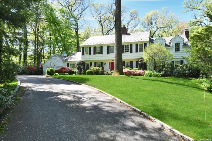 Majestically tucked away up a long private country driveway, this 5 bedroom, 3 1/2 bath Walter Uhl spacious center hall Colonial is set on 2.8 bucolic acres of park-like grounds. Enter into a tranquil home with eat-in kitchen, living room with wood-burning fireplace, library with wood burning fireplace, family room, formal dining room, guest suite with full bath, laundry, and powder room all on the 1st floor. Upstairs offers an oversized primary suite with walk in closet and wood burning fireplace, another bedroom with wood burning fireplace, 2 additional bedrooms and a full bath. Finished basement with gym, storage, wine cellar, playroom. Beautiful mature landscaping and low taxes. Truly a special home.