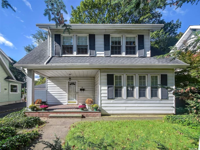 Charming 4 bedroom, 1 1/2 Bath front porch Colonial in the heart of Port Washington! The first floor offers a large living room with wood burning fireplace and French doors leading to screened in porch, a spacious formal dining room, eat-in-kitchen and half bath. The second floor offers 4 bedrooms, 1 bath and access to a generous walk up attic. Other features include HW floors, gas heat, high ceilings and private yard. Very conveniently located to town and LIRR - sold AS IS - make this special home your own.