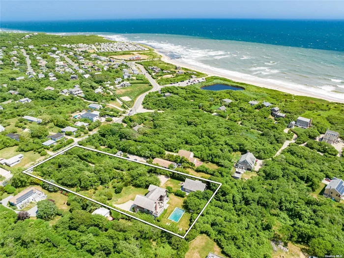 Ditch Plains Coastal Retreat This is the ultimate opportunity to own two contiguous single and separate properties in the coveted surf Mecca of Ditch Plains Beach in Montauk - a dream come true for the discerning buyer. These properties, each with their own private driveway, are just a stone&rsquo;s throw away from the pristine ocean shore. The 5 bedroom main house embodies timeless elegance. Step through the charming, covered porch to the first floor, where you&rsquo;ll find a double-height entry foyer that sets the stage for the rest of this inviting traditional home. The open floorplan seamlessly combines the kitchen with a center island, stainless steel appliances, and a walk-in pantry/laundry room. The dining area flows effortlessly into a light-filled living room adorned with a wood-burning fireplace. As an extra touch of charm, you&rsquo;ll discover an enclosed sunroom with built-in seating and another fireplace, leading to a deck and the inviting pool area. The first floor also hosts two bedrooms that share a full bathroom, along with a powder room to cater to the main living spaces. Upstairs, the primary bedroom boasts a soaring vaulted ceiling, a spa-like bathroom with an oversized shower, dual sinks, a Jacuzzi tub, and a private deck with an outdoor shower overlooking the pool and generous grounds. Ample closet space ensures your comfort. This level also accommodates two guest bedrooms sharing a full bathroom, as well as an additional room perfect for use as an office or gym area. The unfinished basement offers an abundance of storage space or the potential to create extra finished areas to suit your needs. There is plenty of outdoor decking for your enjoyment during the warmer months. You&rsquo;ll find a heated gunite pool and a second outdoor shower, adding to the charm of this exceptional property. Just to the south of the main house, a picture-perfect cottage offers yet another beachside retreat. Sitting on just under half an acre, this home can be landscaped for total privacy or have an open yard to the main house to give a more estate like feel. Vibrant and chic, the two plus bedroom, three-bathroom cottage boasts 1, 200 sq ft of spacious, open living areas with high ceilings. The kitchen features custom built-in seating, and the loft space offers an additional recreation area. Complete with its own laundry facilities, outdoor shower, this cottage is a gem in its own right. This is a rare and exquisite opportunity to own a turnkey compound in sought-after Ditch Plains, just moments from the ocean shore yet quietly tucked away to provide unparalleled privacy. Whether you&rsquo;re seeking a luxurious full-time residence or the perfect summer getaway, this is the quintessential coastal retreat you&rsquo;ve been waiting for. Don&rsquo;t miss your chance to make it yours.