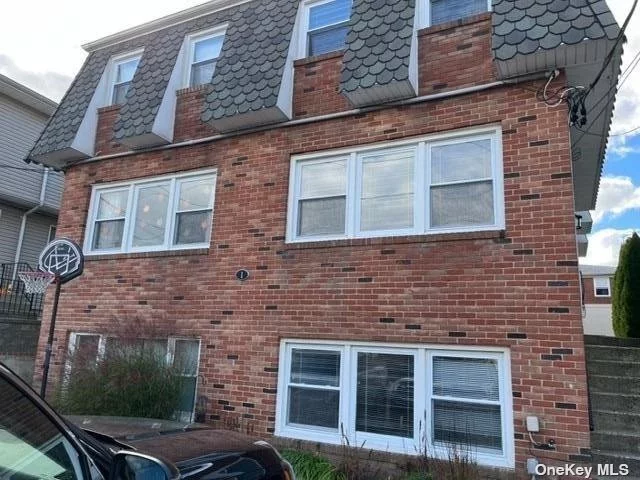 Updated Two Bedroom Apartment with Eat in Kitchen and Plenty of Storage Space. Hardwood Floors Throughout. Newly Finished Recreation Room in Addition to Utility Storage Room on Lower Level. Backyard has New Stone Patios.