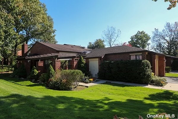 Desirable Corner Belair Ranch with 2 Bedrooms and 2.5 Baths in Estates 1. Enter into a Large Foyer with Granite Floors. The Huge Living Room has a Brick Wood Burning Fireplace with Cathedral Ceilings. There are Glass sliding doors that lead to a Patio. The Formal Dining Room is also Spacious with Moldings and Sliding Door that Leads to a Second Patio. The Skylit Kitchen is Large with Stainless Steel Appliances and Granite Counters. The Primary Bedroom Suite has Cathedral Ceilings, A Dressing Area, Large Fitted Closets and a Marble Bath.  The Second Bedroom can be used as a Den and has its Own Bathroom. There is a Powder Room for Guests. The Lower Level Is Finished and there is 3 Zone Heating. There is a 2 Car Attached Garage with an ADA entrance. The Estates is a Gated Development with a Clubhouse that has an Outdoor Pool, Tennis Courts, Party Room and Kitchen.