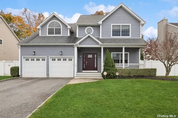 Expanded and renovated in 2018, this pristine 5-bedroom and 4.5-bath Center-Hall Colonial home is located on a quiet, village cul-de-sac. A dramatic 2-story entry leads to a bright and airy open-concept great room with a floor-to-ceiling fireplace flanked by built-ins, a lovely powder room, a charming dining room with board and batten wainscot, and a spectacular chef&rsquo;s kitchen with custom cabinetry, quartzite counters, commercial-grade stainless-steel appliances (including a Viking stove, 2 x 30 Sub-Zero fridge and freezer, Sub-Zero wine refrigeration and undercounter beverage refrigerator, 2 Miele dishwashers, and a microwave drawer), huge island with seating, designer tile, and luxury fixtures and fittings. Main floor also features a large bedroom, perfect for guests or as a home office, a mudroom with custom cabinetry, and a phenomenal laundry area with abundant storage plus 2 washers and dryers. The 2nd floor houses the master suite and features a spacious bedroom with a vaulted ceiling and Palladian window, 2 walk-in closets, and a spa-like marble master bathroom with a dual vanity, generous shower, and free-standing tub. All additional bedrooms are sizable with ample closet space and bathrooms are tastefully designed with classic tile and high-end fixtures. Partially finished walk-out lower level ideal as play space, home gym, or additional storage. The property boasts a manicured lawn, mature plantings, and a lovely patio for al fresco entertaining. Highlights include gleaming hardwood floors throughout, classic design and quality craftsmanship, a generator, sprinklers, and maintenance-free vinyl siding and fence. Complete with a 2-car garage, this incredible residence is just minutes to the heart of Syosset shopping, dining, and has the LIRR close by which provides a convenient commute to NYC.