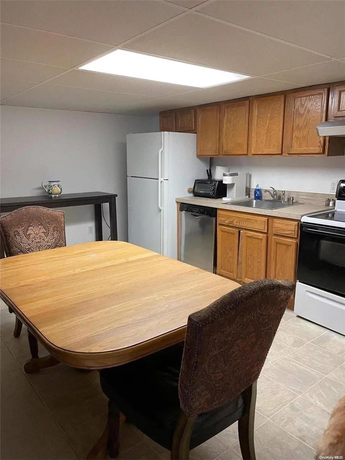 spacious basement studio apt, fully furnished with kitchen, dining area , TY, Queen size bed,  full bath, utilities are included, tenant must have excellent credit,  side street parking.