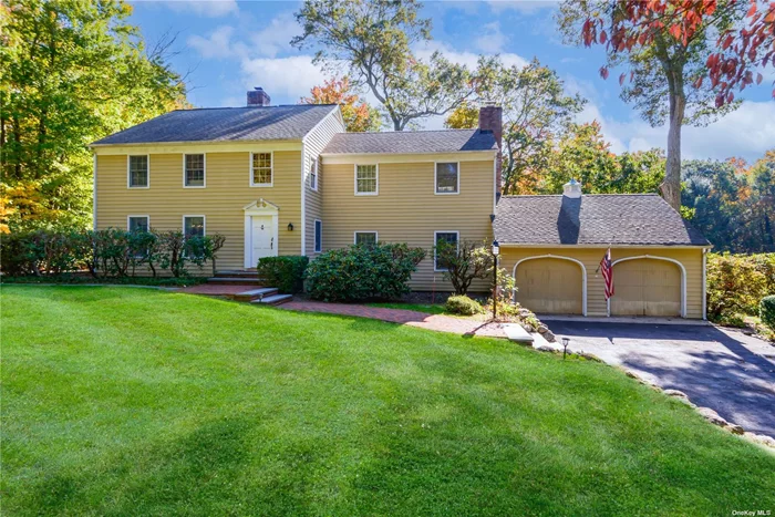 Welcome to this charming 4-bedroom, 2-3 full bath home nestled on a generous 2.014-acre lot in the heart of Muttontown. This picturesque property offers a tranquil and serene country setting while being convenient to train station, shopping centers, the Muttontown Preserve, Muttontown police, and town hall. Encased in timeless cedar clapboard, this home exudes warmth and comfort. The main level boasts elegant hardwood flooring and comfortable principal rooms, while the 2nd level skylight floods the home with natural light. The family room/library features built-in bookcases and cabinets, providing both functionality and a tasteful design element, while French doors beckon you outside to a sprawling patio. Ample closets throughout ensure your storage needs are met, and a 2-car garage provides plentiful parking and additional storage space. This home is designed for comfort and practicality with updated electric systems, ensuring peace of mind. Enjoy climate control with 2-zone central air conditioning and 2-zone oil heating providing comfort year-round. 50-gallon water heater and oil burner installed in 2008. Septic tank with overflow tank, central vacuum system. Gardening enthusiasts will appreciate the greenhouse with sink and outdoor water spigot, along with meticulously maintained grounds and mature specimen plantings. A 6-zone in-ground sprinkler system makes lawn care a breeze. For those with equestrian interests this property features a 4-STALL BARN with its own driveway, hayloft, tack room, sinks, outdoor water spigot, grass paddock/riding ring area, perfect for housing horses or other animals. One of the notable features of this property is its location, surrounded by magnificent estates offering both privacy and a sense of grandeur. This home offers blend of country living and modern convenience. From its all-wood flooring to its central vacuum system, barn, and tranquil surroundings, this property provides a unique opportunity to enjoy the best of Long Island living. Don&rsquo;t miss the chance to make this your new home.