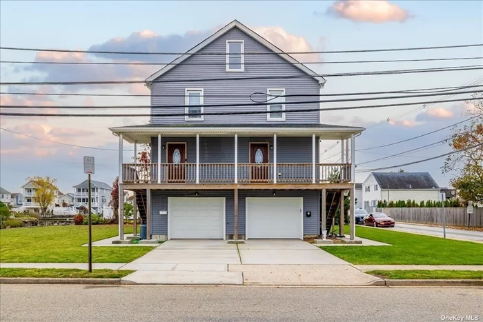 Rare Legal 2 Family Opportunity Located In The Heart Of South Freeport! Just Minutes Away From The Nautical Mile. Located On The End Of Canal, Paddleboard/Kayak From Your Backyard. Raised & Completely Renovated In 2014. Roof, Siding & Windows Less Than 10 Years. Gas Heating Is Less Than 5 Years. Lower Unit Has 3 Bedrooms, Updated Full Bath, Ductless AC Unit, Hi Hats, Oak Floors Throughout, Updated EIK w/ Granite Counters, Laundry Hookup & Huge Garage; Room For 2-3 Cars Or Exercise/Rec Area. Upper Unit Has 2 Bedrooms, Updated Bath & Kitchen, Formal Dining Room, Private Balcony w/ Sliders To Living Room, Walk Up Attic For Storage Or Can Be Finished For Extra Living Space, 2-3 Car Deep Garage Currently Fits A Car, Pool Table & Exercise Area & Laundry Hookup In Unit. Oversized Corner Lot w/ 2 Side Yards & Conveniently Located To Parkways, Parks, Schools, Rec Center, Restaurants & Nightlife On Nautical Mile & Much More!