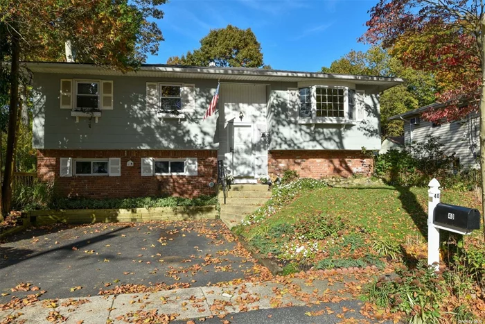 Step inside to this charming hi-ranch home. The open floor plan allows for great entertaining space with ease. Formal Living Room, Dining Room, Eat-In-Kitchen, 4 Bedrooms, one Full and one 1/2 Bath. The garage was converted into additional living space. Extra features include hardwood floors, updated windows and a breathtaking landscaped backyard. Lovely block. Close to All!