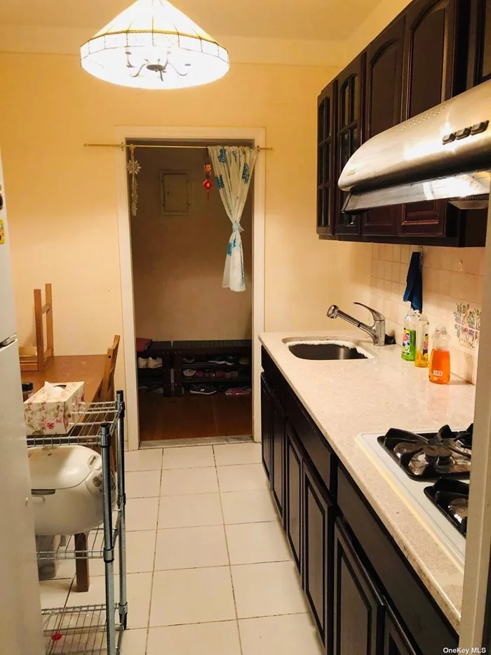 Locate A Center Of The Elmhurst with Excellent condition and location, Large Apartment around 1200 sq feet, plenty of natural light. All utilities included except for electricity. Walk To Queens Center Mall, Walk to M, R, 7 Train, Buses, and Restaurant, Library, Supermarket. Mint Condition. Convenient to all...Must see...