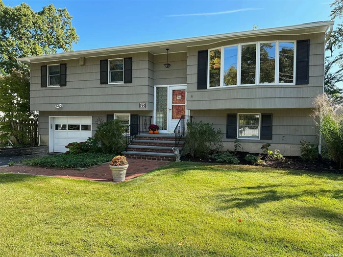 Welcome! is set on a quiet cul-de-sac and is close to the center of town, schools and beaches. Its deep and lush property offers winter water views from the primary bedroom, kitchen, dining room and deck. The bright eat-in-kitchen, dining room and Trex deck adds to the charm of this remarkably well-maintained home. Hardwood floors thru-out and large picture windows create a welcoming space to enjoy year-round. The living room, dining room and eat-in kitchen all have cathedral ceilings with bright natural light throughout. Both bathrooms have been renovated with custom finishes. The large deck overlooks the picturesque Mill Neck Creek Nature Preserve and Bird Sanctuary and has access to the deep, fenced backyard with room for a pool. The first floor includes a generous great room/den w/full sky light bathroom & sliders to the patio. This home is equipped with a whole house Generac generator and water purifier. Gas heat adds to the efficiency of this lovely & bright home. In addition, a new LG washer/dryer. This house is an exceptional opportunity for those seeking a harmonious blend of comfort and nature. Call for more details.