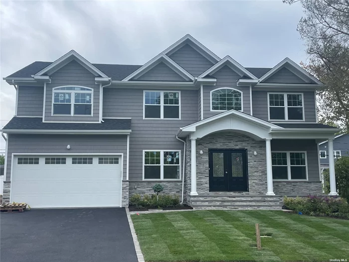 Construction Almost Complete - Hamptons Colonial 5 Bedrooms 4.5 Bath. 2 Master bedroom suites! One spacious Master suite on 1st floor and another Oversized Master Suite on the 2nd floor makes this home perfect for extended family...Bright, open floor plan is perfect for entertaining!