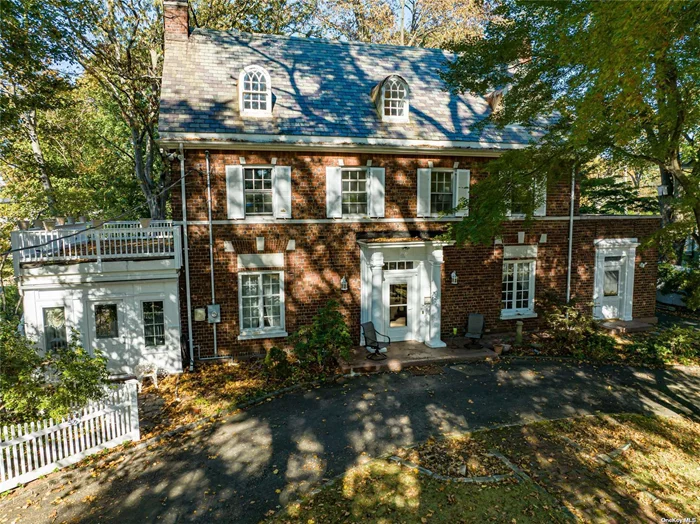 LOCATION LOCATION LOCATION! This Magnificent Brick Colonial Mansion stands as a tribute to the days of fine craftsmanship and quality construction. This home sits on an oversized 1/2 acre plus (known as Doctor&rsquo;s Row) in the much sought after and convenient hamlet of Glen Cove. Only a short stroll to town and area attractions as well as the LIRR station and ferries to NYC. Less than 30 miles to NYC it is a easy commute for work or visit to one of the most vibrant cities in America. Take a stroll along the brand new Waterfront Park at Garvies Point after dining at one of the many eclectic area restaurants. This community has it all! Other features include, Circular Driveway, Slate Roof, Two Separate Entrance for Main and second Floor Suites. Possible Mother/Daughter (with permits) or commercial. Also convenient to area Hospitals, golf, shopping. Come take a look it does need some TLC but will be well worth to live in this splendid location! This oversized lot lends itself to future expansion and room for a swimming pool!