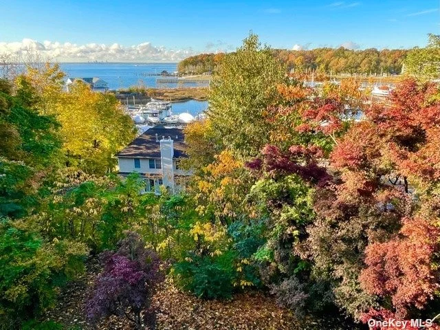 Gorgeous Townhouse Apartment Overlooking Hempstead Harbor With Magnificent Views. All Updated Baths, Kit, S/S Appliances. Newer Wood Flooring/Carpet. . Must See! Decks on Every Level!